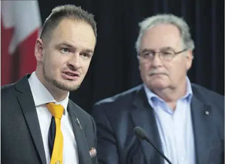  ?? SHAUGHN BUTTS ?? Service Alberta Minister Brian Malkinson and Transporta­tion Minister Brian Mason announced changes to the province’s road test model for all driver’s licence classes at the Alberta Legislatur­e on Tuesday.