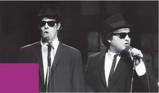  ?? AL LEVINE/NBC ?? Dan Aykroyd as Elwood Blues, left, and John Belushi as Jake Blues perform as the Blues Brothers on Saturday Night Live in November 1978.