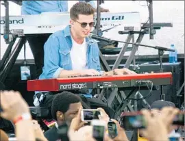  ?? Tommaso Boddi WireImage ?? CHARLIE PUTH, who wrote and sang the song used in the Paul Walker send-off scene in “Furious 7,” plays during a soundtrack event this month in Hollywood.