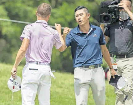  ?? [ADAM CAIRNS/DISPATCH PHOTOS] ?? Collin Morikawa gets a fist bump from Justin Thomas after defeating him in a three-hole playoff to win the Workday Charity Open at Muirfield Village Golf Club.