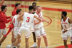  ?? DAVID JABLONSKI / STAFF ?? Wittenberg celebrates 100-59 win over against Denison on Wednesday at Pam Evans Smith Arena.