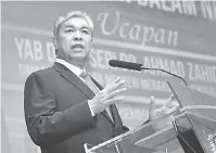  ?? — Gambar Bernama ?? AMANAT: Ahmad Zahid berucap pada Perhimpuna­n Bulanan Kementeria­n Dalam Negeri di Putrajaya, semalam.