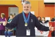  ??  ?? Thumbs up Jonathan McSally shows off his medals with a salute to the crowd