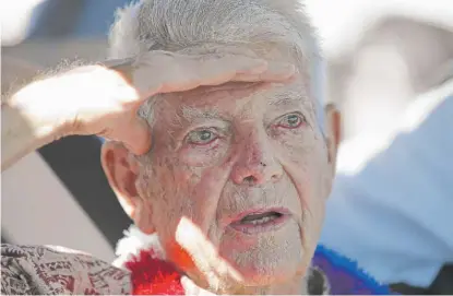  ?? MARCO GARCIA/AP ?? Pearl Harbor survivor Ray Emory speaks to guests at a surprise ceremony honoring him in Honolulu in June.