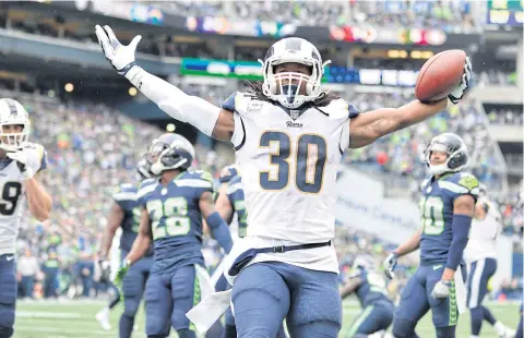  ?? USA TODAY SPORTS ?? Rams running back Todd Gurley celebrates after scoring a touchdown against the Seahawks.