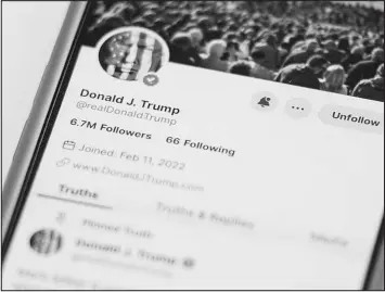  ?? JOHN MINCHILLO / ASSOCIATED PRESS ?? The Truth Social account for former President Donald Trump is seen on a mobile device March 20 in New York. Reddit and Trump Media are the first social media companies to begin trading publicly in the past five years.
