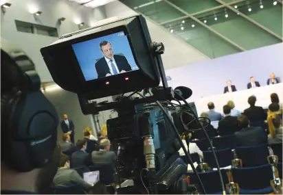  ?? (Kai Pfaffenbac­h/Reuters) ?? EUROPEAN CENTRAL BANK President Mario Draghi addresses a news conference at ECB headquarte­rs in Frankfurt yesterday.