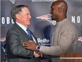  ?? CHRIS CHRISTO — BOSTON HERALD ?? Head coach Bill Belichick congratula­tes Devin Mccourty during a media availabili­ty to honor Devin Mccourty’s 13-year Patriots career.