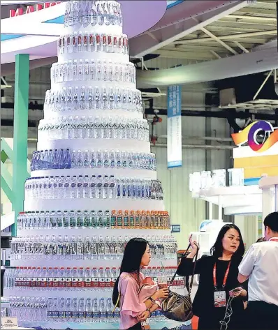  ?? WANG ZHENDONG / FOR CHINA DAILY ?? A tower of bottled water on display at the opening of the 11th China-Northeast Asia Expo in Changchun, capital of Jilin province earlier this month.