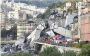  ?? LUCA ZENNARO/ANSA VIA AP ?? Rescuers work to recover an injured person Tuesday after the Morandi highway bridge collapsed in Genoa, northern Italy.