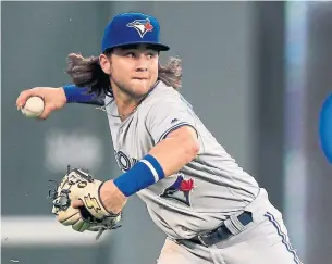  ?? ORLIN WAGNER THE ASSOCIATED PRESS ?? Shortstop Bo Bichette made his major-league debut and helped turn a double play in the sixth inning of Monday night’s game in Kansas City.