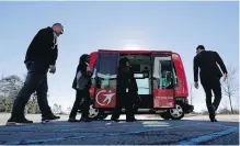  ??  ?? A driverless shuttle sits on display at the Riverside EpiCenter in Austell, Georgia.