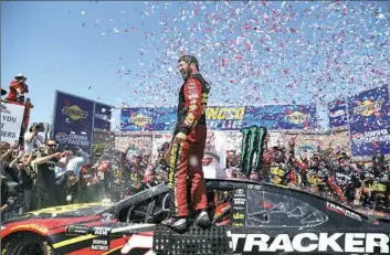  ?? Brian Lawdermilk/Getty Images ?? Martin Truex Jr. celebrates in Victory Lane after winning Sunday at Sonoma Raceway.