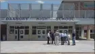  ?? H John Voorhees III / Hearst Connecticu­t Media file photo ?? Gov. Ned Lamont talks to local officials before a press conference at Danbury High School.