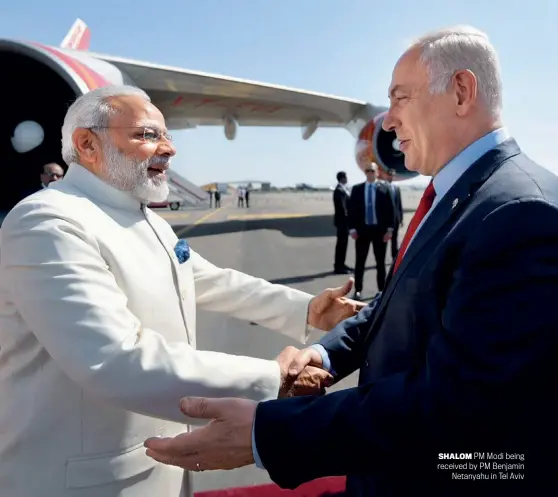  ?? PTI ?? SHALOM PM Modi being received by PM Benjamin Netanyahu in Tel Aviv