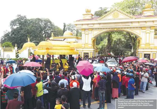  ??  ?? People from alll walks of life line the streets to pay their last respects as the hearse carrying the remains of Sultan Abdul Halim passes.