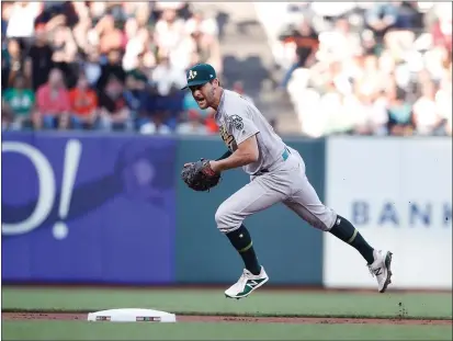  ?? RANDY VAZQUEZ — BAY AREA NEWS GROUP FILE ?? The Oakland Athletics’ Chad Pinder tries to make a play during the third inning against the San Francisco Giants at Oracle Park in San Francisco on Aug. 13, 2019.