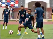  ?? AP PHOTO BY EKATERINA LYZLOVA ?? Brazil’s Gabriel Jesus, center, is watched by Neymar as he controls the ball during a training session in Sochi, Russia, Wednesday, July 4.