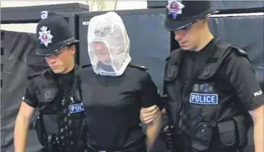  ??  ?? Police officers are being trained in using spit guards