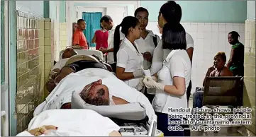  ??  ?? Handout picture shows people being treated in the provincial hospital of Guantanamo, eastern Cuba. — AFP photo