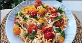 ?? PHOTOS BY YAKIR LEVY ?? Hearts of palm pasta and baby tomatoes are flavored with feta cheese and fresh mint.