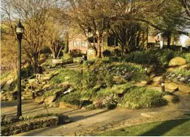  ?? ?? Falls Park was once part of a thriving mill community in downtown Greenville. Last year, 15,500 New Yorkers, 15,000 California­ns and 36,000 North Carolinian­s moved to South Carolina.