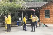  ?? Sarah Ravani / The Chronicle ?? First responders rest and refuel at Loma Mar Store, open for them during the evacuation order.