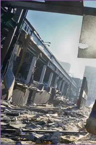  ?? Picture: Efrem Lukatsky/AP Photo ?? A Ukrainian soldier stands on amid the ruins after Russian shelling of a shopping centre in Kyiv a few days ago when at least eight people were killed in the attack