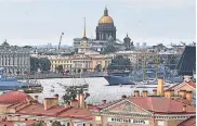  ?? ALEXEY NIKOLSKY/ SPUTNIK/ AFP VIA GETTY IMAGES ?? Warships take part in Russia’s Navy Day in 2021 in St. Petersburg, where Putin’s political career began.