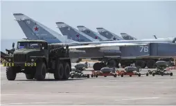  ??  ?? RUSSIAN MILITARY jets are seen at an air base in Syria in June.