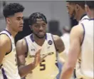  ??  ?? Ualbany’s Jamel Horton, center, talks to teammates during a break in the action Saturday vs. UMBC in their America East contest.