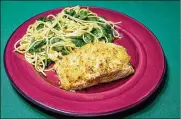  ?? LINDA GASSENHEIM­ER / TRIBUNE NEWS SERVICE ?? Parmesan-Crusted Salmon with Spaghetti and Spinach.