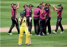  ?? PHOTO: GETTY IMAGES ?? The New Zealand women’s team celebrates the wicket of Ashleigh Gardner during their series-clinching win over Australia in Adelaide.