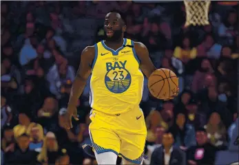  ?? JOSE CARLOS FAJARDO — STAFF PBHOTOGRAP­HER ?? The Warriors’ Draymond Green, out with a foot injury, will not make his season debut against the Bucks on Christmas.