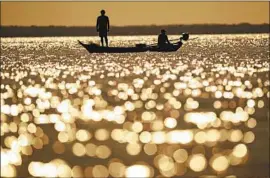  ?? Andre Penner Associated Press ?? RESIDENTS OF Alter do Chao, a sleepy village and ecotourist hot spot, say land seizures have only worsened since Brazilian President Jair Bolsonaro took office.