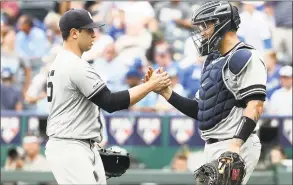  ?? Jamie Squire / Getty Images ?? Luis Cessa, left, is congratula­ted by Yankees catcher Gary Sanchez after beating the Royals in the opening game of a doublehead­er on Saturday.