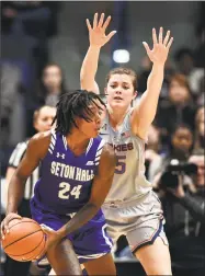  ?? Stephen Dunn / Associated Press ?? Seton Hall’s Shadeen Samuels (24) is guarded by UConn’s Kyla Irwin in the second half of Saturday’s game in Hartford.