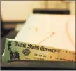  ?? Associated Press ?? In this file photo, trays of printed Social Security checks wait to be mailed from the U.S. Treasury’s Financial Management services facility in Philadelph­ia.