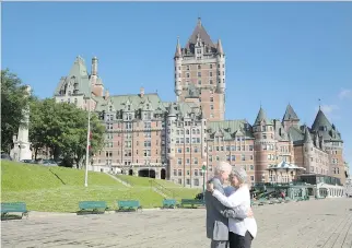  ?? FLYTOGRAPH­ER ?? Couple Ruth and Stephen, share an intimate moment outside Fairmont Le Chateau Frontenac in Quebec City, where they marked their ninth wedding anniversar­y by hiring vacation photograph­y service Flytograph­er to document their experience.