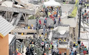 ?? PHOTO: TNS ?? Devastatio­n . . . Rescue teams search for pupils trapped in the rubble at Enrique Rebsamen School in Colonia Nueva Oriental Coapa, in Mexico City, on September 19, 2017, after a magnitude 7.1 earthquake rocked central Mexico.