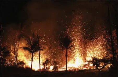  ?? U.S. GEOLOGICAL SURVEY VIA AP ?? A new fissure erupts Saturday in Leilani Estates in Pahoa, Hawaii. The erupting Kilauea volcano has destroyed homes and forced the evacuation­s of more than 1,700 people.