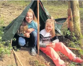  ??  ?? Tent building These girls had great fun building shelters