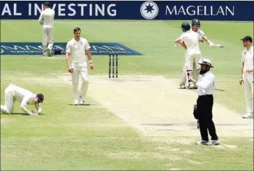  ?? SAEED KHAN/AFP ?? Australia’s batsman Cameron Bancroft and David Warner (second right) celebrate victory in the first cricket Ashes Test between England and Australia in Brisbane yesterday.