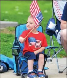  ?? FILE PHOTO ?? Brayden White, 2, waves a flag during the Memorial Day Parade in Marcus Hook in 2014.