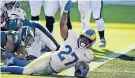  ?? [CHRIS SZAGOLA/ASSOCIATED PRESS] ?? Darrell Henderson of the Rams reacts after scoring a touchdown during the second half against the Eagles.