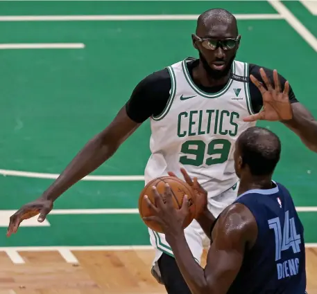  ?? MATT STONE PHOTOS / HERALD STAFF ?? TACKO TIME: Celtics center Tacko Fall along with rookie Aaron Nesmith, top, got some run against an undermanne­d Grizzlies team on Wednesday night in 126-107 blowout victory.