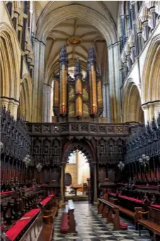  ??  ?? The chancel of Beverley Minster, with its 16th century carved wooden seats, also known as misericord­s, or mercy seats, used in prayer.