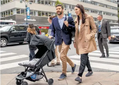  ??  ?? Jacinda Ardern in New York with Clarke Gayford and baby Neve in a photo issued by her office today.