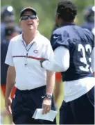  ?? | NAM Y. HUH/ AP ?? Bears coach John Fox talks to running back Jeremy Langford during minicamp Tuesday at Halas Hall.