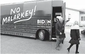  ?? CHARLIE NEIBERGALL/AP ?? Democratic presidenti­al candidate Joe Biden and his wife, Jill Biden, arrive at a meeting Sunday, in Carroll, Iowa. The former vice president is on an eight-day bus tour of the state.